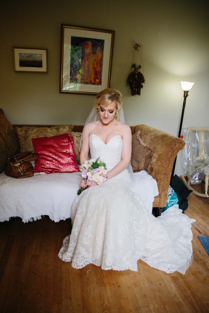 Bride seated in her getting ready room before the ceremony Alisha Marie Eau Claire Wedding Photographer