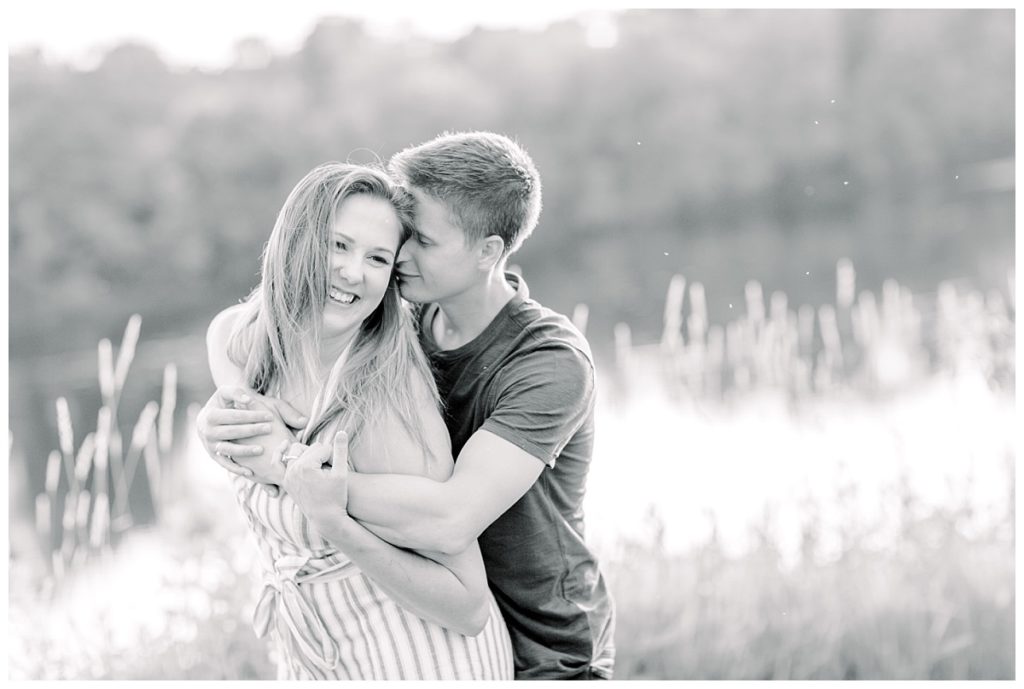 downtown Eau Claire wisconsin engagement session  images taken at phoenix park  black and white snuggles and laughing