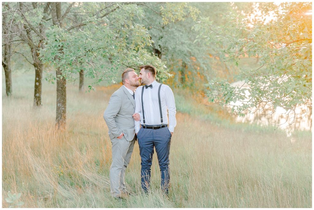 Metropolis Wisconsin Wedding wisconsin lgbt+ wedding grooms posing for portraits lgbtq friendly photographer nose to nose pose