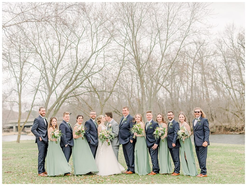 Taken by Wisconsin wedding photographer Alisha Marie Photography, specializes in Eau Claire wedding photographer, family photos Eau Claire wedding dress shop and image portrait in wisconsin and Stillwater minnesota rainy day wi wedding photographer wedding party portraits