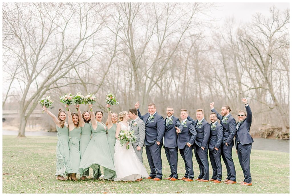 Taken by Wisconsin wedding photographer Alisha Marie Photography, specializes in Eau Claire wedding photographer, family photos Eau Claire wedding dress shop and image portrait in wisconsin and Stillwater minnesota rainy day wi wedding photographer wedding party portraits