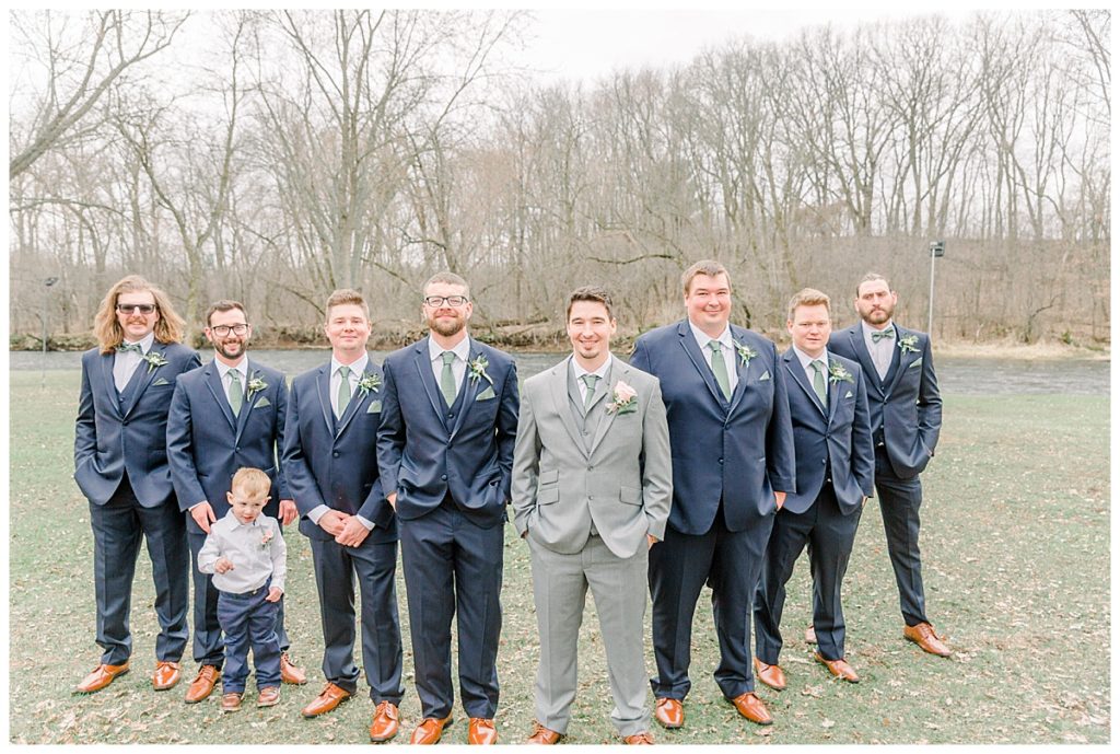 Taken by Wisconsin wedding photographer Alisha Marie Photography, specializes in Eau Claire wedding photographer, family photos Eau Claire wedding dress shop and image portrait in wisconsin and Stillwater minnesota rainy day wi wedding photographer wedding party portraits with only groomsmen