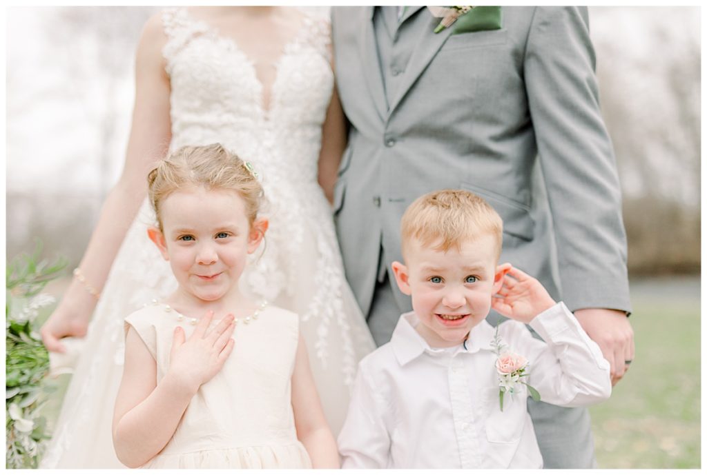 Taken by Wisconsin wedding photographer Alisha Marie Photography, specializes in Eau Claire wedding photographer, family photos Eau Claire wedding dress shop and image portrait in wisconsin and Stillwater minnesota rainy day wi wedding photographer wedding party portraits adorable flower girl and ring bearer