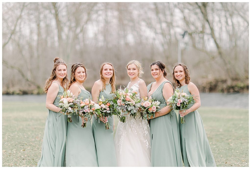  Taken by Wisconsin wedding photographer Alisha Marie Photography, specializes in Eau Claire wedding photographer, family photos Eau Claire wedding dress shop and image portrait in wisconsin and Stillwater minnesota rainy day wi wedding photographer wedding party portraits with only bridesmaids