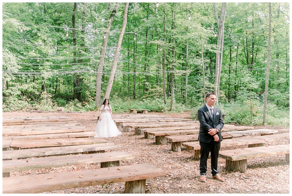 Wedding at Fest Valley Events has a rock theme including a rock tail hour. Eau Claire Wedding Photographer Alisha Marie shoots wedding outside Cadott First look at the ceremony site before wedding day photography