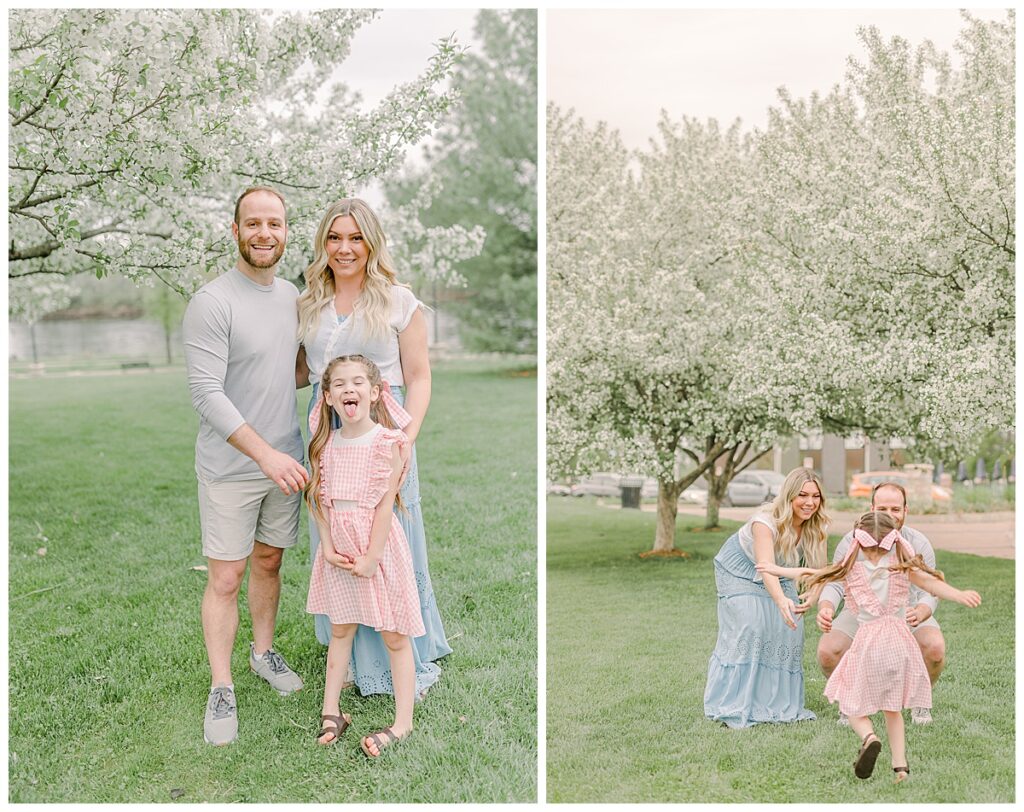 posed portrait of 2 parents and their little girl, taken during the spring at Phoenix Park in Eau Claire, Wisconsin with blossoms in the background of the photo Wisconsin Wedding photographer. Eau Claire Family Photos.