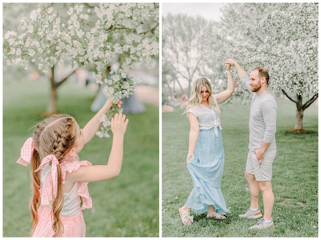Side by side images of a family photo session. In the first image, the little girl pulls down a tree branch to get a better look at the blossoms. In the second, a husband looks at his wife while she twirls at Phoenix Park in Eau Claire, Wisconsin with blossoms in the background of the photo Wisconsin Wedding photographer. Eau Claire Family Photos.