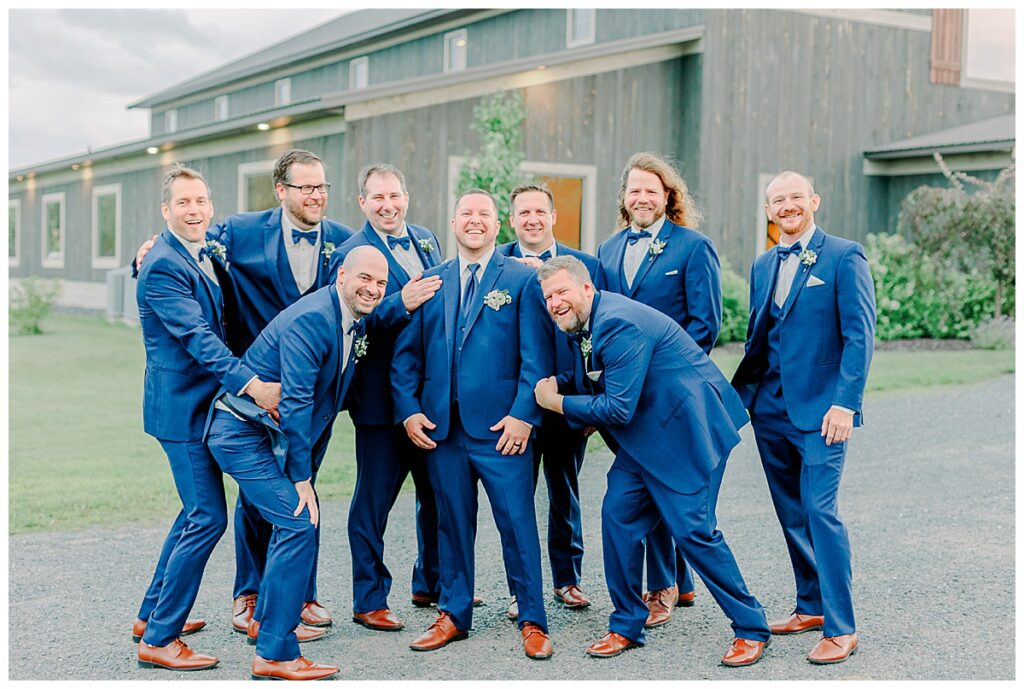 groom and groomsmen outside lillydale dance hall in Chippewa falls Wisconsin