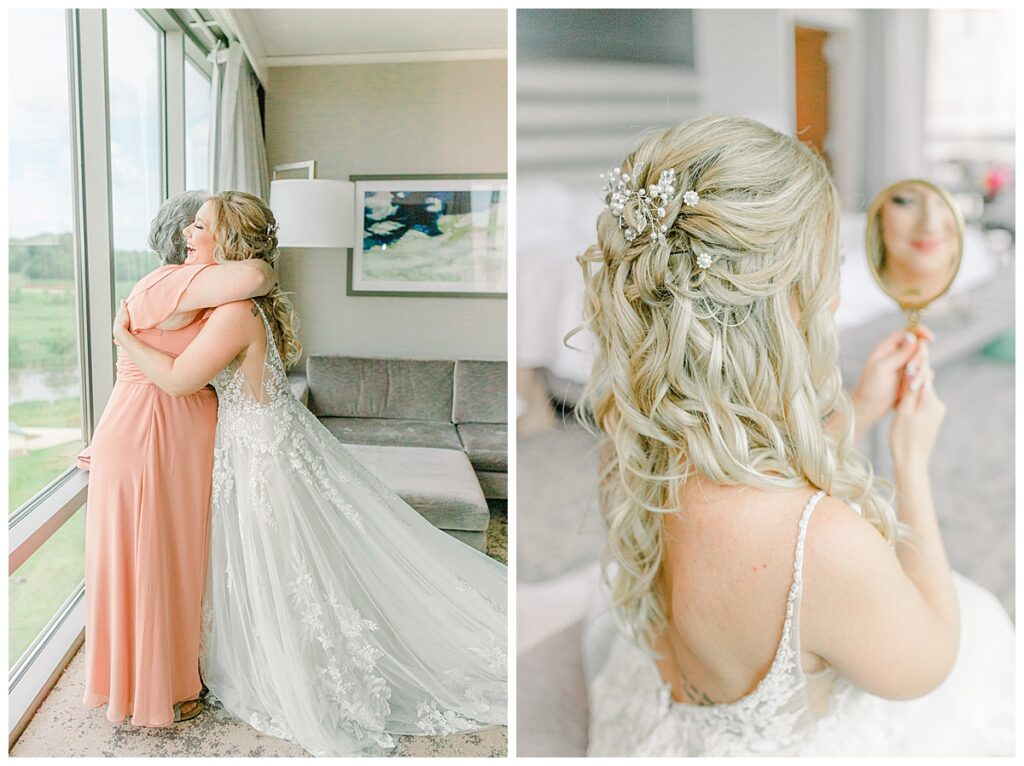 Bride embraces her mom near a large window while getting ready for her wedding portraits at a venue in minnesota