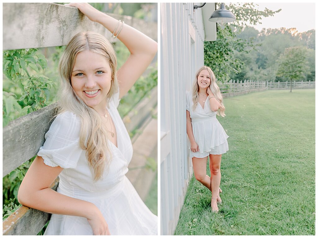 Senior poses for portraits  near Eau Claire Wisconsin. wearing a white romper, leaning agains a barn