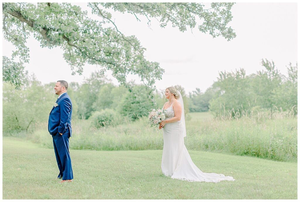 Bride and groom take a quiet moment to breath before their first look at lillydale dance hall outside of Eau Claire wisconsin Image taken by Eau Claire photographer. Wisconsin Wedding photographer. Eau Claire Family Photos.