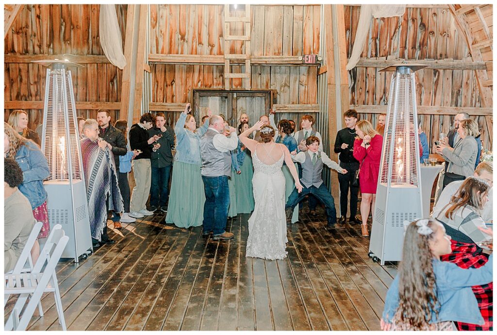 Candid wedding dance and party image captured by Alisha Marie Photography at the wedding venue alluring acres near Chippewa Falls Wisconsin