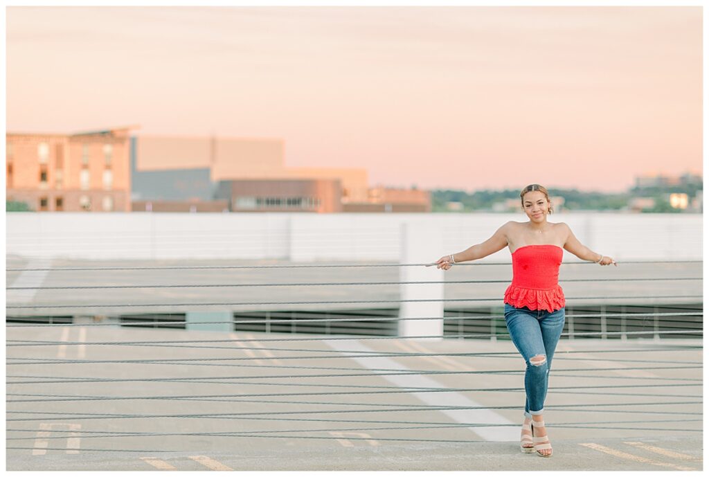 Senior Photos in Downtown Eau Claire on a parking garage taken by Alisha Marie Photography 