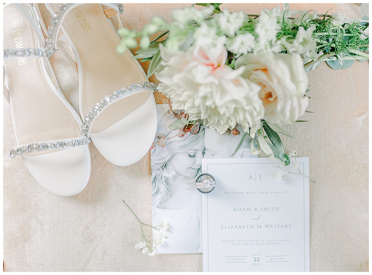 Detail image of bride shoes and a summer bouquet at Lillydale Dance Hall in Eau Claire Wisconsin