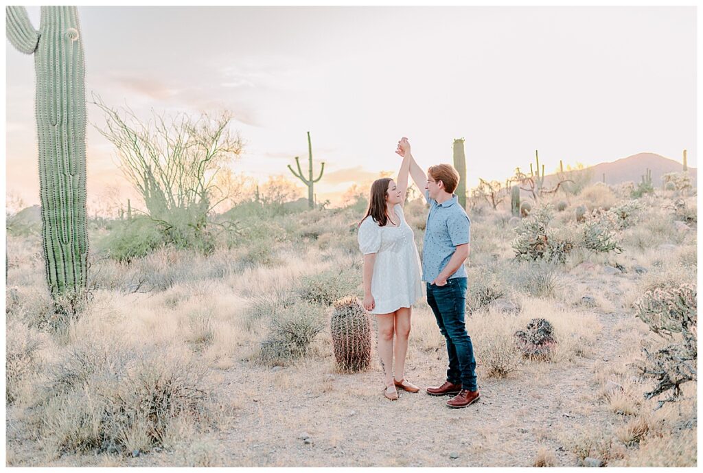 Usery Mountain Regional Park outside of Phoenix Arizona Close up of couple almost kissing, engagement portraits and pose ideas. Cactus location with mountains in the background