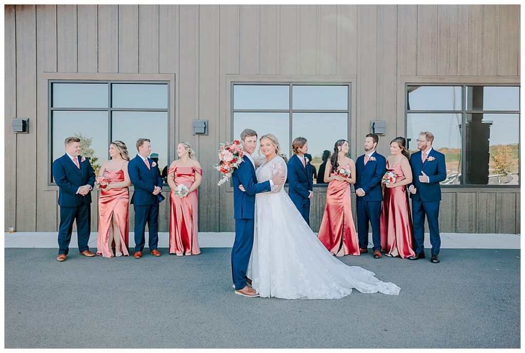 wedding party celebrating at the eau claire event center during a fall wedding. Photography by Alisha Marie Photography- eau claire wedding photographer